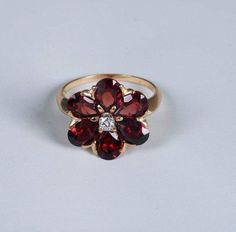 "Metal: Yellow Gold Ring Size: 7.25 Main Stone: Garnet Main Stone Shape: Pear Metal Purity: 14k Main Stone Color: Red This is a 5 Gram 14K Yellow Gold Floral Design Garnet and Diamond Ring, size 7.25. It is pre owned but shows little if any wear. Stock # WT016R08Most rings are sizable for a small fee. If the ring you are considering is the incorrect size contact us for a quote.Payment Through Paypal within 3 days of purchase. I ship to U.S addresses only. No international shipping. Returns accep Garnet And Diamond Ring, Garnet Engagement Ring, I Love Jewelry, Fine Jewelry Designers, Yellow Gold Earring, Garnet Rings, Yellow Gold Ring, Gold Floral, Ring Size 7