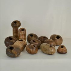 a group of ceramic vases sitting next to each other on a white table top