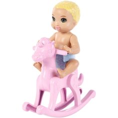 a baby doll sitting on top of a pink rocking horse