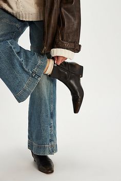 You’re effortlessly cool in these easy slip-on ankle boots, featuring a chic snip toe and low, slanted block heel, all in a smooth vegan leather for a modern take on a timeless style. **Features:** Ankle length, vegan leather uppers, snip toe, inner ankle zipper, low block heel **Why We | Easy Does It Vegan Ankle Boots by FP Collection at Free People in Brown, Size: US 8.5