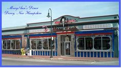 the front of a restaurant with blue and red stripes on it's side walk