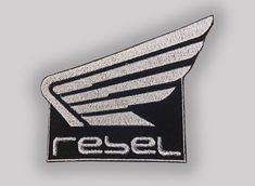 an embroidered badge with the word resel on it's front and back side