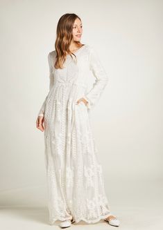 This adorable maxi dress is fully lined, a great modest wedding dress or an LDS temple-ready wedding dress. This boho style is very elegant, with a beautiful lace embroidery in cotton over tulle. It is comfortable and drapes nicely. It features a round neckline with fully lined sleeves and bodice. Long dress has 2 pockets in each side and no zipper just pull on quick and easy. The dress comes in sizes XS, S/M, M/L, XL and XXL Fabric: Tulle with embroidery 100% cotton Fully lined: 100% Polyester Floor-length Lace Maxi Dress With Floral Embroidery, Floral Embroidered Lace Floor-length Maxi Dress, Lace Maxi Dress With Floral Embroidery For Wedding, Modest Lace Dress With Lace Sleeves, Delicate Lace Maxi Dress, Spring Wedding Maxi Dress With Lace, Bohemian Maxi Dress With Floral Embroidery For Wedding, White Lace Sleeves Maxi Dress For Wedding, White Flowy Maxi Dress For Wedding