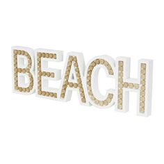 the word beach spelled with beads in white and brown colors on a white background photo