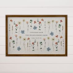 a cross stitch pattern with flowers and the words, consider how the wildflowers grow