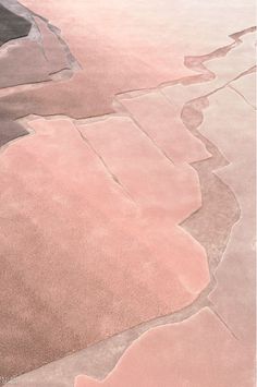 an aerial view of pink and black land