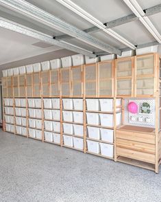 an empty storage room with lots of bins