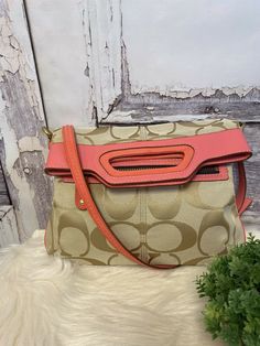 Coach Khaki/Coral Bonnie Fold Over Crossbody Bag 13393. A few marks near top on patent leather and leather, Check photos. Inside is clean with two pocket sleeves and zip comp. Snap closure Goldtone hardware Measures 14”H from top of handle to bottom of bag 12”L Up to 21” adjustable shoulder strap drop Buyer must make payment within two days after purchase. Coach Shoulder Bag With Removable Pouch For On-the-go, Coach Shoulder Satchel With Zipper Closure, Coach Crossbody Satchel With Adjustable Strap, Coach Crossbody Shoulder Bag With Zipper Closure, Coach Crossbody Shoulder Bag, Coach Crossbody Shoulder Bag With Zipper, Coach Satchel Shoulder Bag With Zipper, Coach Satchel With Zipper Closure As Shoulder Bag, Detachable Handle Crossbody Shoulder Bag