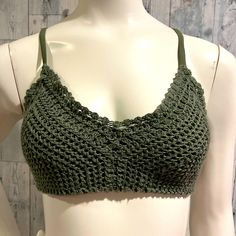 Super Cute Bikini Top Is A Crochet Top In An Olive/Army Green. Lined Large 100% Polyester Top And Lining Cups 7.5” Tall Cups 7” Wide Band From Cup To Cup 12” Removable Pads Excellent New Condition Beach Camisole Crop Top With Built-in Bra, Fitted Camisole With Crochet Lace, Green Seamless Bra For Beach, Seamless Green Bra For Beach, Beach Green Seamless Bra, Beach Crop Top Camisole With Built-in Bra, Fitted Beach Camisole With Straps, Fitted Beach Camisole, Camisole Crop Top With Built-in Bra For Beach