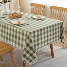 a green and white checkered table cloth on a dining room table