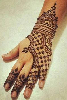 a henna tattoo on the palm of someone's hand