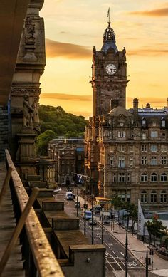 an old building with a clock tower in the background