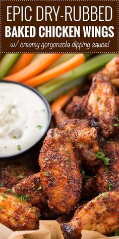 baked chicken wings with ranch dip and carrots in the background, text overlay reads epic dry - rubbed baked chicken wings w / gravy gorgonzoloa dipping sauce