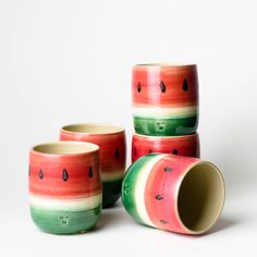 four watermelon cups are stacked on top of each other, with one cup in the middle