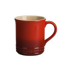 a red coffee mug with the words le creuset on it