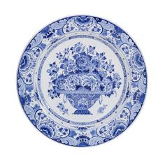 a blue and white plate with an ornate design on the front, featuring flowers in a vase