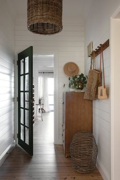 the hallway is clean and ready to be used as a place for hanging baskets on the wall