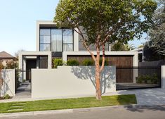 a house with a tree in front of it