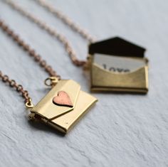 This great locket is shaped like an envelope with a working clasp, and fitted inside is a tiny surprise secret message which can read the words of your choice! You may add any message to go inside the envelope locket, to a maximum of 20 words. Please let me know what youd like the personalised message to say in the Notes to Sellers box when checking out. The locket is made from vintage brass which has mellowed over time to a beautifully rich gold colour. I have added a rosy little copper hea... Envelope Necklace, Gold Colour, Locket Necklace, Cute Jewelry, Locket, Things I Want, Wish List, Envelope, United Kingdom