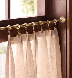 Easily hold your cafe curtains in place with our Cafe Drapery Ring Set. An easy way to add charm to your kitchen or living room windows, this versatile design features a tension rod, center bracket, and rings with removable clips that can be clipped directly onto the curtain or removed to use as hooks. Tip: We recommend 1 set of rings per 24" curtain panel + 1 additional ring for each 24" of curtain width.. Details You'll Appreciate Versatile att Pantry Window Covering, Gold Cafe Curtain Rod, Cafe Curtain With Drapes, Kitchen Sink Cafe Curtains, Roll Down Curtains, Pantry Cafe Curtain, Curtains Historic Home, Brass Tension Curtain Rod, Unlaquered Brass Curtain Rod