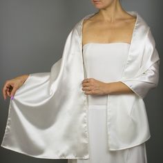 A very elegant satin shawl wrap shrug for your wedding , party or evening dress Color: ivory ( also available in white or black ) Size : 160 cm x 40 cm You can use it as a wrap, shawl or stola. You can find a matching sating bridal purse / bag in our Etsy shop or just contact us. We accept credit cards. Elegant Fitted Solid Shrug, Fitted Wedding Shawl Wrap, Elegant Satin Shawl For Formal Occasions, Elegant Cream Shawl For Evening, Elegant Fitted White Shawl, Elegant Satin Shawl For Wedding, Elegant Satin Wedding Shawl, Elegant White Evening Shawl, Elegant Silk Wraps For Wedding