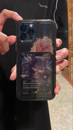 someone is holding up their phone case to show it