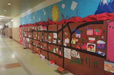 a hallway with many bulletin boards on the wall