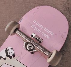 a pink skateboard with an image of a panda bear on it