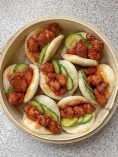 small dumplings with meat and cucumbers in a wooden bowl