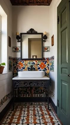 a bathroom with a sink, mirror and tiled flooring in the middle of it