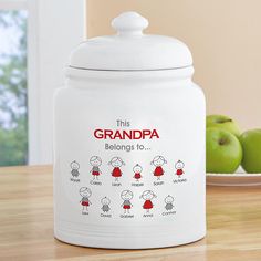 this is an image of a grandma's kitchen canister with apples in the background