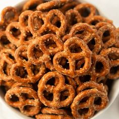 a white bowl filled with pretzels on top of a table