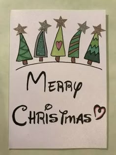 a christmas card with trees and hearts on it