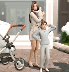 two people standing next to each other with a baby in a stroller behind them