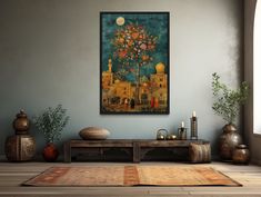 a painting on the wall above a table with candles and vases next to it