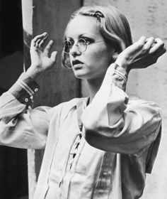 black and white photograph of a woman in glasses