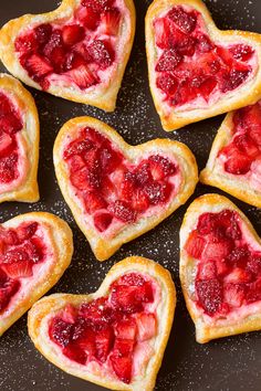 heart shaped pastries with strawberries on them