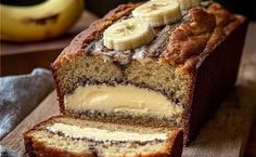 a loaf of banana bread with sliced bananas on top