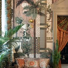 a living room filled with furniture and plants