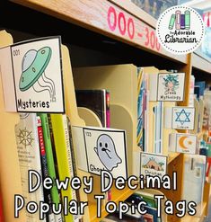 a book shelf filled with lots of books next to a sign that says devily decimal popular topic tags