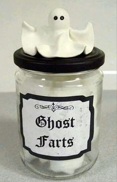 a glass jar with a fake ghost in it's lid that says ghost parts