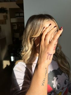 Bow tattoo on hand Bow On Pinky Tattoo, Matching Behind Ear Tattoos, Bow Finger Tattoos For Women, Bow Tattoo On Finger, Bow Hand Tattoo, Bow Tie Tattoos For Women, Bow Tattoo Behind Ear, Bow Tattoo Finger