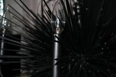 a close up view of a black umbrella with many lights on the top and bottom