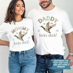 a man and woman standing next to each other wearing matching shirts that read, mommy lucky duck