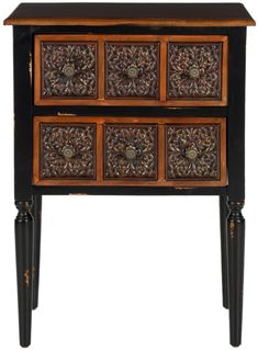 an ornate wooden table with drawers