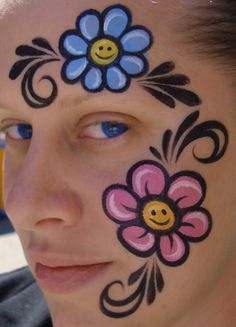 I saw someone walking around with a dora the explorer towel and it had flowers that kinda looked like this on it....lol it made me smile so i put it on my face hoping it would make someone else smi... Flower Face Paint Ideas, Hippie Face Paint, Flower Face Paint, Easter Face Paint, Face Painting Flowers, Face Paint Ideas