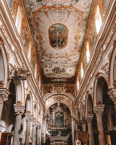 the interior of an old church with painted ceilings