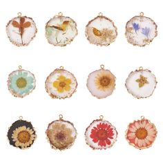 nine different flower pendants in various shapes and sizes