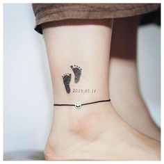 a woman's foot with a tattoo on her ankle that reads 2013 01 11