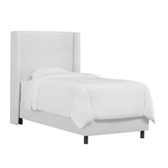 a bed with white sheets and pillows on top of the headboard, in front of a white background